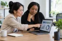 A business owner and operations lead review a concise baseline before planning digital work.